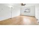 This bedroom features hardwood floors, a ceiling fan, and a large window at 18830 E 16Th Pl, Aurora, CO 80011