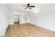 Bright bedroom featuring hardwood floors, a ceiling fan, and a closet at 18830 E 16Th Pl, Aurora, CO 80011