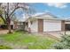 Charming single-story home featuring a brick and white painted exterior and an attached two-car garage at 18830 E 16Th Pl, Aurora, CO 80011