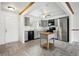 Well-lit kitchen featuring tile flooring, gray cabinets, modern appliances, and an island at 18830 E 16Th Pl, Aurora, CO 80011