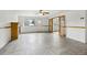 Spacious living room boasting tile flooring, a fireplace, and glass paneled doors at 18830 E 16Th Pl, Aurora, CO 80011