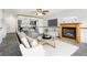 Inviting living room with fireplace, adjacent kitchen, and stylish furniture arrangement at 18830 E 16Th Pl, Aurora, CO 80011