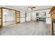 Spacious living room boasting tile flooring, a fireplace, and glass paneled doors into the kitchen at 18830 E 16Th Pl, Aurora, CO 80011