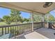 Inviting covered porch offers scenic view of lush lawn and park-like surroundings at 3080 Madison Ln, Broomfield, CO 80023