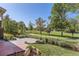 Beautiful backyard features a paved patio and stone landscaping overlooking a picturesque park at 3080 Madison Ln, Broomfield, CO 80023