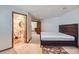 Bedroom with ensuite bathroom and a wooden bed frame at 3080 Madison Ln, Broomfield, CO 80023