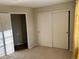 Bedroom with carpeted floor and a closet with sliding doors at 3080 Madison Ln, Broomfield, CO 80023