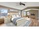 Spacious main bedroom featuring vaulted ceiling, hardwood floors, and a study area with large windows at 3080 Madison Ln, Broomfield, CO 80023