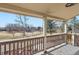 Inviting covered porch offering views of the lush community green space and playground at 3080 Madison Ln, Broomfield, CO 80023