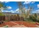 Landscaped backyard with wood fence, brick paver walkway, and views of the surrounding mountains at 15785 W Second Ave, Golden, CO 80401