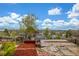 Scenic backyard view with gazebo and mature trees set against a mountain vista at 15785 W Second Ave, Golden, CO 80401