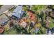 Aerial view of backyard featuring a patio, fire pit, garden, and lush greenery at 15785 W Second Ave, Golden, CO 80401