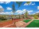 Backyard featuring a gazebo, a fire pit, and beautifully designed landscaping, with views of the city at 15785 W Second Ave, Golden, CO 80401