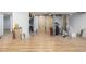 Unfinished basement with exposed beams, barn doors, and laminate flooring at 15785 W Second Ave, Golden, CO 80401