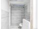 Bathroom with large shower featuring intricate gray and white accent tiling at 15785 W Second Ave, Golden, CO 80401