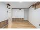 Spacious bedroom under construction, featuring hardwood floors, a closet, and a view into the next room at 15785 W Second Ave, Golden, CO 80401