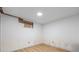 Empty bedroom under construction, featuring hardwood floors and a small window at 15785 W Second Ave, Golden, CO 80401