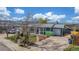 Exterior view of a charming home with a well-maintained yard and unique architectural details at 15785 W Second Ave, Golden, CO 80401