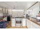 Bright kitchen with stainless steel oven, wooden countertops and white cabinets with see-through doors at 15785 W Second Ave, Golden, CO 80401