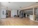 Open concept living room showing hardwood floors, bright light and an open transition to the kitchen area at 15785 W Second Ave, Golden, CO 80401