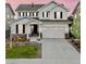 Charming two-story home with white siding, dark shutters, stone accents, and well-maintained landscaping at 7756 S Eaton Park Ct, Aurora, CO 80016
