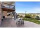 Beautiful outdoor patio area with seating, overlooking a well-maintained yard and scenic view at 7756 S Eaton Park Ct, Aurora, CO 80016