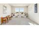 Bright playroom with carpet, natural light, storage shelves, and a view to neighborhood at 7756 S Eaton Park Ct, Aurora, CO 80016