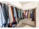 Walk-in closet with organized shelving and hanging racks to maximize storage space at 7756 S Eaton Park Ct, Aurora, CO 80016