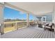 Relaxing outdoor back porch with comfortable seating, a fire pit, and scenic views at 1884 Myron Ct, Erie, CO 80516