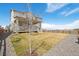 Well-maintained backyard with healthy grass, modern home exterior, and inviting porch view at 1884 Myron Ct, Erie, CO 80516