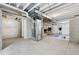 Unfinished basement featuring concrete floors, utility components and equipment at 1884 Myron Ct, Erie, CO 80516