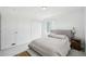 Cozy bedroom featuring carpet, white walls, large windows, and closet space, perfect for relaxing and unwinding at 1884 Myron Ct, Erie, CO 80516