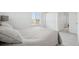 Bright bedroom features a large window, closet, and neutral color palette at 1884 Myron Ct, Erie, CO 80516