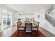 Bright open space dining and kitchen area, featuring hard wood floors and a modern interior at 1884 Myron Ct, Erie, CO 80516