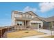 Beautiful two-story home featuring a well-manicured lawn and an attached two-car garage at 1884 Myron Ct, Erie, CO 80516