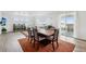 Open-concept dining and living area filled with natural light and sliding doors to the outside at 1884 Myron Ct, Erie, CO 80516