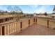 View of back deck with wooden railing, wooden floorboards, and view of backyard at 10930 Albion Ct, Thornton, CO 80233