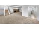 Finished basement with neutral carpet, brick fireplace, and access to a full bathroom at 10930 Albion Ct, Thornton, CO 80233