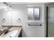 Bathroom featuring a modern vanity, sink, towel rack and a frosted window at 10930 Albion Ct, Thornton, CO 80233