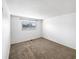 A carpeted bedroom with neutral walls and one window providing natural light at 10930 Albion Ct, Thornton, CO 80233