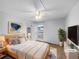 Cozy bedroom with neutral carpet, ample natural light, ceiling fan, and closet at 10930 Albion Ct, Thornton, CO 80233