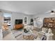 Bright living room with hardwood floors, neutral paint, large windows, and modern furniture at 10930 Albion Ct, Thornton, CO 80233