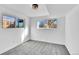 Bright bedroom featuring plush carpet and natural light from two windows with pleasant outdoor views at 1173 Xenon St, Golden, CO 80401