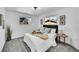 Bright bedroom featuring plush carpet, neutral tones, decorative wall art, and natural light from two windows at 1173 Xenon St, Golden, CO 80401