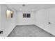 Bright, carpeted bedroom with white walls, dual windows, and recessed ceiling lights at 1173 Xenon St, Golden, CO 80401