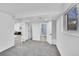 Carpeted bedroom with open doorway to bathroom with a shower and window at 1173 Xenon St, Golden, CO 80401