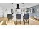 Contemporary kitchen with a central island, modern lighting fixtures, and an adjacent dining area perfect for entertaining at 1173 Xenon St, Golden, CO 80401