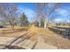 Scenic view of a park with lush greenery, mature trees, and walking paths, ideal for outdoor recreation at 1173 Xenon St, Golden, CO 80401