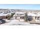 Two-story house in a snow-covered neighborhood, aerial view at 1275 Exquisite St, Castle Rock, CO 80109