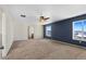 Primary bedroom with a view, carpet, and access to the bathroom at 1275 Exquisite St, Castle Rock, CO 80109